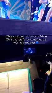 Step into the role of Conductor during White Christmas at Paramount Theatre! 🎶💙 This is the view the amazing @dorykan has as he conducts the orchestra and singers throughout Blue Skies, the show-stopping number choreographed by @tiffanykrausechoreo! Come see it live until January 11th, 2026! - @brianselcik’s takeover ✨ | Paramount Theatre