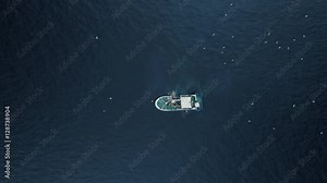 Zoom out of a Commercial Ship Fishing with Trawl Net on the Sea. Top down view. Shot on RED Cinema Camera in 4K (UHD). Stock Video