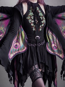 36K reactions · 1.8K shares | @Rightmew wears the Metamorphosis hoodie with its vivid moth wings framing the silhouette like enchanted armor. The Tangled Vines bodysuit, Spellbound Mini skirt and Nocturne Winged boots complete the look with layers of texture, embroidery and movement. WWW.RESTYLE.PL What Restyle products can you spot on the shelf to the right? ✨ | Restyle | Facebook