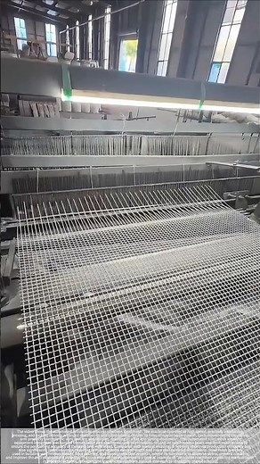 Automated mechanical process for weaving steel mesh.