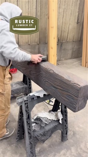 Rustic Lumber Company on Instagram: "Final touches in progress 🔨 Drew is putting the finishing details on a custom wood mantle at our Kaysville yard, featuring a deep wire-brushed, hand-hewn texture in our popular Longhorn finish. This piece brings bold character, rustic texture, and timeless craftsmanship—perfect for statement fireplaces and mountain-inspired homes. 📍 Kaysville, Utah 🪵 Custom mantles • Hand-hewn beams • Premium wood finishes #CustomMantle #HandHewn #WireBrushed #customhomes 