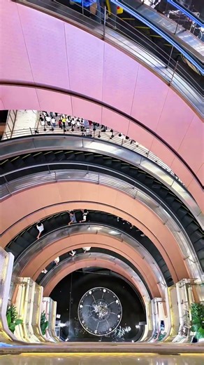 Spiral escalator inside the NEW ONE department store