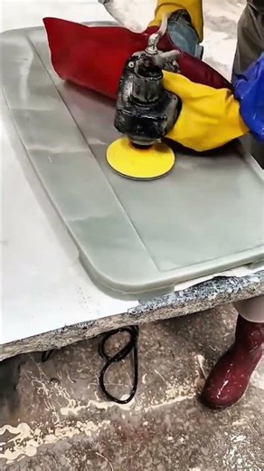 Polishing and smoothing the surface of a stone or composite slab using a power buffer