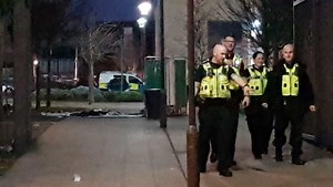 Police at the scene of the stabbing outside Joseph Chamberlain College