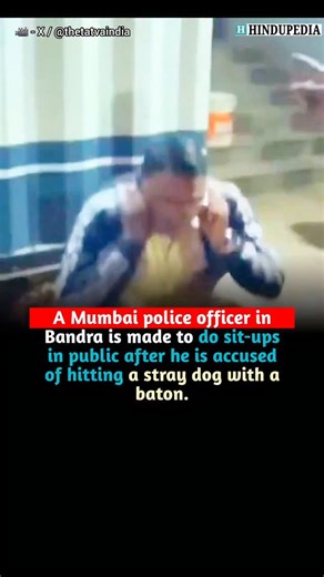 Hindupedia on Instagram: "Mumbai’s Bandra Bandstand shows a plainclothes police officer forced to do sit-ups before an angry crowd after allegedly hitting a stray dog with his baton. Locals surrounded the officer, demanding an apology and accountability for animal cruelty. The incident triggered sharp online debate. Some praised public empathy toward animals, while others condemned it as mob justice humiliating a police officer. Mumbai Police have not issued any official statement yet."