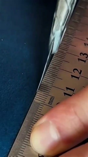 the stage of drilling holes in a piece of leather into several parts using a special tool#tools