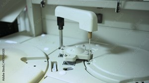 Automated Laboratory Machine Examines Blood Samples For Medical Analysis. Automated Laboratory Equipment. Modern Machine Mechanisms.