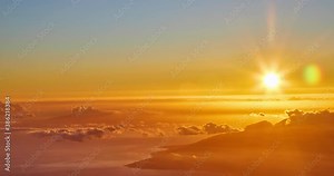 Time Elapse of setting sun above moving clouds above the Valley and ocean at the island of Maui from the top of the Haleakala Vocanic Crater,Haleakala National Park, Maui, Hawaii,USA