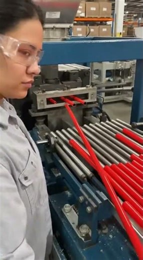 Woman Utilizing Press Machine for Plastic Broom Handles