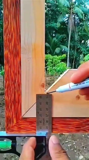 Marker marks wood—ruler guides rhythm of frame, grain,measure aligns true with crafted precision