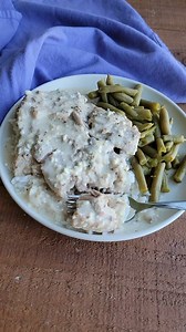 These creamy ranch pork chops are tender and delicious. Just load up the Crockpot with a few simple ingredients and come home to a fabulous meal. This is one of our favorites and it is sure to become a hit at your house as well. Full printable recipe: https://cookingwithcarlee.com/crockpot-creamy-ranch-pork-chops/ | Cooking With Carlee