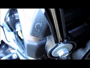 How to adjust the headlights in the Honda Jazz?