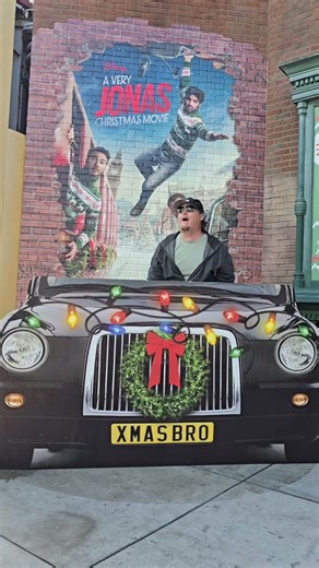 POV: My husband finds the Jonas Brothers photo op at DCA 💀