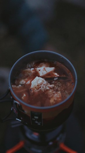 Nothing is better than a hot steaming Korean stew on a cold, dark, damp day. This soft tofu stew is the perfect, hearty backpacking dish for your next adventure. You can find these Morinaga Tofu on Amazon! 500ml - water 1 cup - Dried Shiitake Mushrooms 3 tsp - chicken stock powder 1 tbsp - Gochugaru (Korean Red Pepper Powder) 1 pack - Firm Morinaga Tofu 1 cup - Instant Rice Steps: 1. Boil 500ml of water in a pot. Add mushrooms, shiitake mushrooms, stock powder, and gochugaru. If needed you can t
