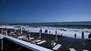 storm on the beach. swimming is prohibited. Beach is danger for swimming. Sunny beach during warm afternoon with huge blue waves. Lifeguard
