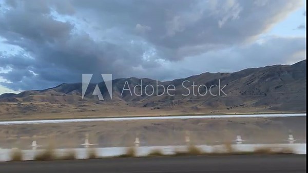 I-80 Utah driving POV shows Great Salt Lake reflections and mountains