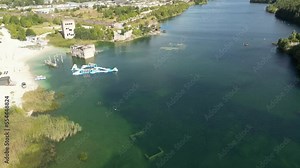 Abandoned Rummu quarry for extraction of limestone, turquoise lake with underwater prison in the middle. Underwater city, at the bottom of lake. natural rock formation underwater