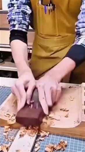 Using A Small Hand Plane To Carefully Create Thin Wood Shavings On A Workbench