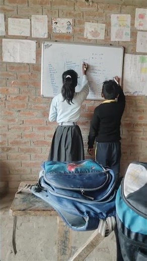 girl and boy write the word pawer