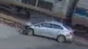 Amtrak train crashes into car after driver went around railroad crossing arms