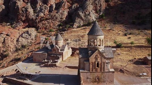 Noravank Monastery and St. Astvatzatzin church, Armenia. 13th-century monastery with a bi-level church showcasing medieval cantilever architecture. 4K Aerial