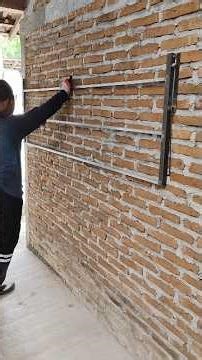 the process of making a folding clothesline that is mounted on the wall