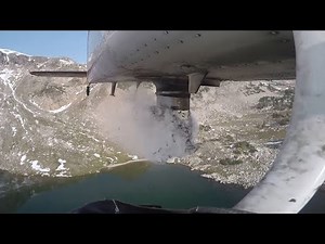 Aerial stocking fish in Colorado's mountain lakes