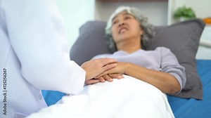 Friendly nurse taking care of patient woman in a hospital room. Treatment of patients.