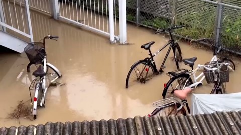Heavy rain triggers floods, landslide in southern Japan