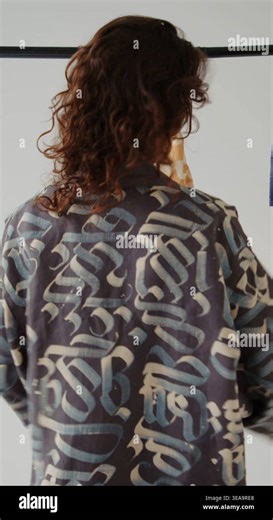 Stylish model showcases unique fashion pieces in a modern studio Stock Video Footage - Alamy