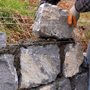 2.2M views · 43K reactions | Building a Stone Retaining Wall | DIY & Crafts | Facebook