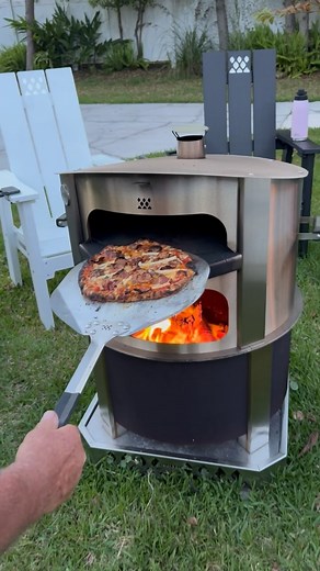 4.4M views · 6K reactions | We are getting better...still 100% delicious! I can't get over how easy and FUN this Breeo pizza oven is. When done cooking, just lift it off and enjoy the smokeless fire with food and loved ones. @breeo has created something special here. And we are all for it. #pizzaoven #breeo #pizza #firepit #cooking #backyard #family #friends #smokeless #madeintheusa #spring | TOOLS by Design | Facebook