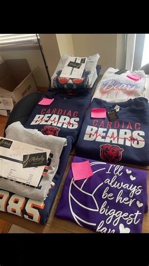 So many custom orders🤍 And wow… my heart is FULL. From custom team gear, spirit wear, rhinestone pieces, and one-of-a-kind designs — every single stack on this table represents a customer who chose Melody Creations, trusted me with their vision, and supported my small business. I don’t take that lightly. The notes, the repeat orders, the referrals, the “can you make this?” messages — they mean more than you know. Thank you for allowing me to create for your teams, your families, your game days,