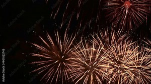 Closeup shot of fireworks exploding in the night sky. Explosion of pyrotechnics. 4K