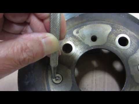How to remove stripped off retaining screw on brake rotor