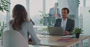 Afro-american hiring manager doing recruit job interview in office. Young woman applying for future job explaining abilities talking about employment.