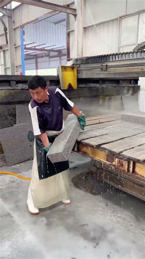 The video showcases the processing and installation of granite curbstones. Known for its hardness,