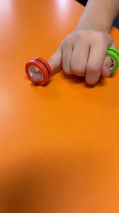 MAGNETIC RING FINGER FLIP A quick share of an activity that we tried last week. This one was for older kids. We worked on resting our forearm and wrists on the table, isolating individual fingers to flip the ring vertically. We were building individual finger strength through isolated dynamic movements which are especially needed for typing. I’m working on creating some picture cards to go with this activity so children can match the colours onto specific fingers (like the game ring ring which u