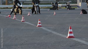 Motorcycle Driving Lessons between traffic cones Moto Gymkhana Motorcyclists