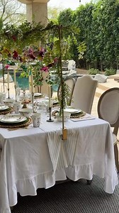 Obsessed with this garden tea party theme! Look at those gorgeous blooms, the perfect blue sky, and the fluttering butterflies! Feeling inspired for your own wedding? Check out for even more inspo with us: https://weddedwonderland.com/10-of-the-most-popular-wedding-themes-and-how-to-achieve-them/ Video @thejoyfuldecorator | Wedded Wonderland