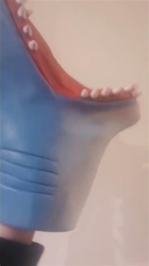 Shark puppet makes blue Shark puppet a loud yawn