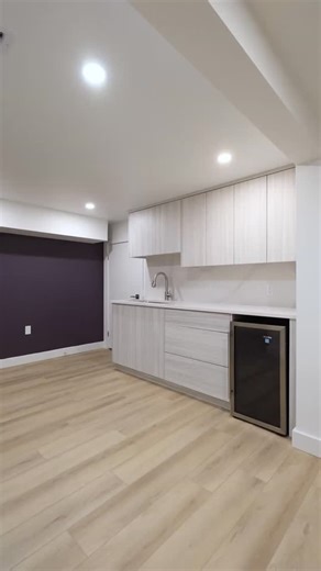 Frontier Building Group on Instagram: "What was once an unfinished, under-used basement is now a warm, accessible suite designed for comfort, safety, and independence. This full transformation on Old Mill Street in Paris includes new LVP flooring, custom bathroom, kitchenette, egress window, cedar accents, modern lighting, and a cozy gas fireplace. All planned to support aging in place with dignity. For Liz and Graham, this renovation wasn’t just a facelift. It was a future-proof design that all