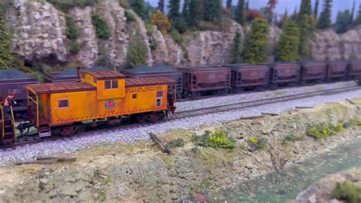 MOW cleanup along Batten Creek has mainline ore traffic at a crawl. | Suncoast Model Railroad Club