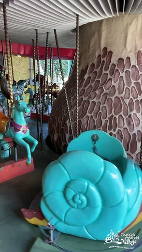 GKTW's wheelchair accessible Enchanted Carousel is one of the Village's most memorable attractions, featuring 22 hand-carved animals. We are grateful to premiere attractions designers Wooddesign Amusement Rides BV and Vekoma Rides Manufacturing B.V. from the Netherlands for helping us create priceless memories for wish families. | Give Kids The World