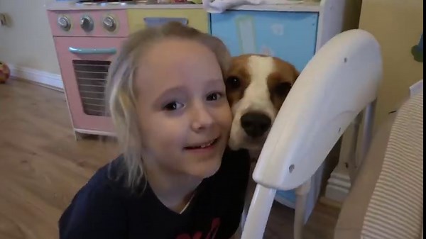 Training our beagle dog to babysit the newborn