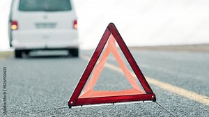 Car, road and warning triangle for accident, vehicle breakdown or assistance alert in nature. Minibus, safety and hazard symbol or sign on street for warning, attention or signal in countryside.