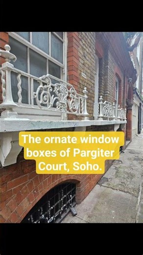The ornate window boxes of Pargiter Court, Soho.