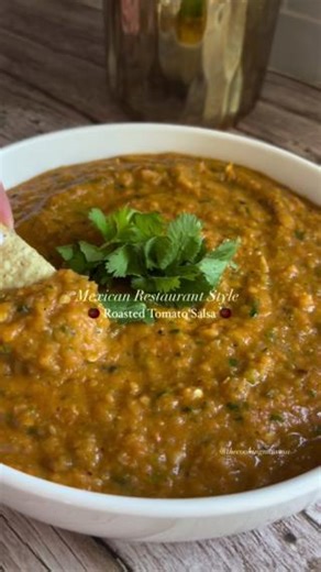 7.9K views · 18 reactions | This Roasted Tomato Salsa has us craving some spice and freshness, courtesy of @thecookingmawma  - 4 roma tomatoes, quartered - 2 small yellow onions, quartered - 6 garlic cloves, peeled - 2 jalapeños - 3tbsp olive oil - 1tbsp chicken bouillon - 1/2 cup coriander - Juice of 1 lime - 1tsp salt, more to taste | Vitamix | Facebook