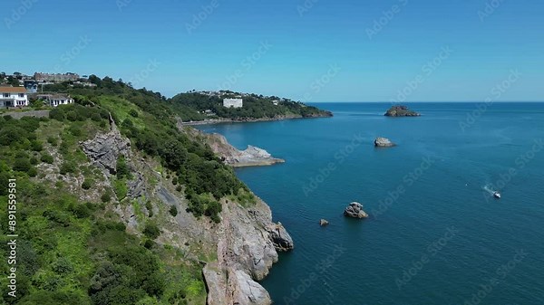 Torquay, Torbay, South Devon, England: DRONE VIEWS: London Arch and the coastline, Meadfoot beach, Shag Rock, Thatcher Rock and Orestone. Torbay is a popular English holiday resort.