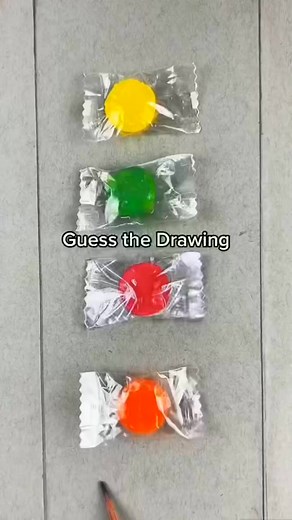 Sweet surprises! 🎁 Can you guess the drawing? 🟡🟢🔴🧡 #PuzzleFun #CandyGuessing | Allys Hemingway